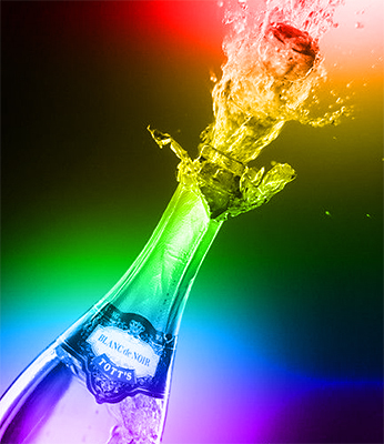 Photo of champagne bottle exploding in celebratory mode