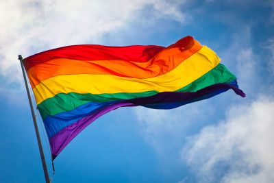 Rainbow flag waving in the breeze.